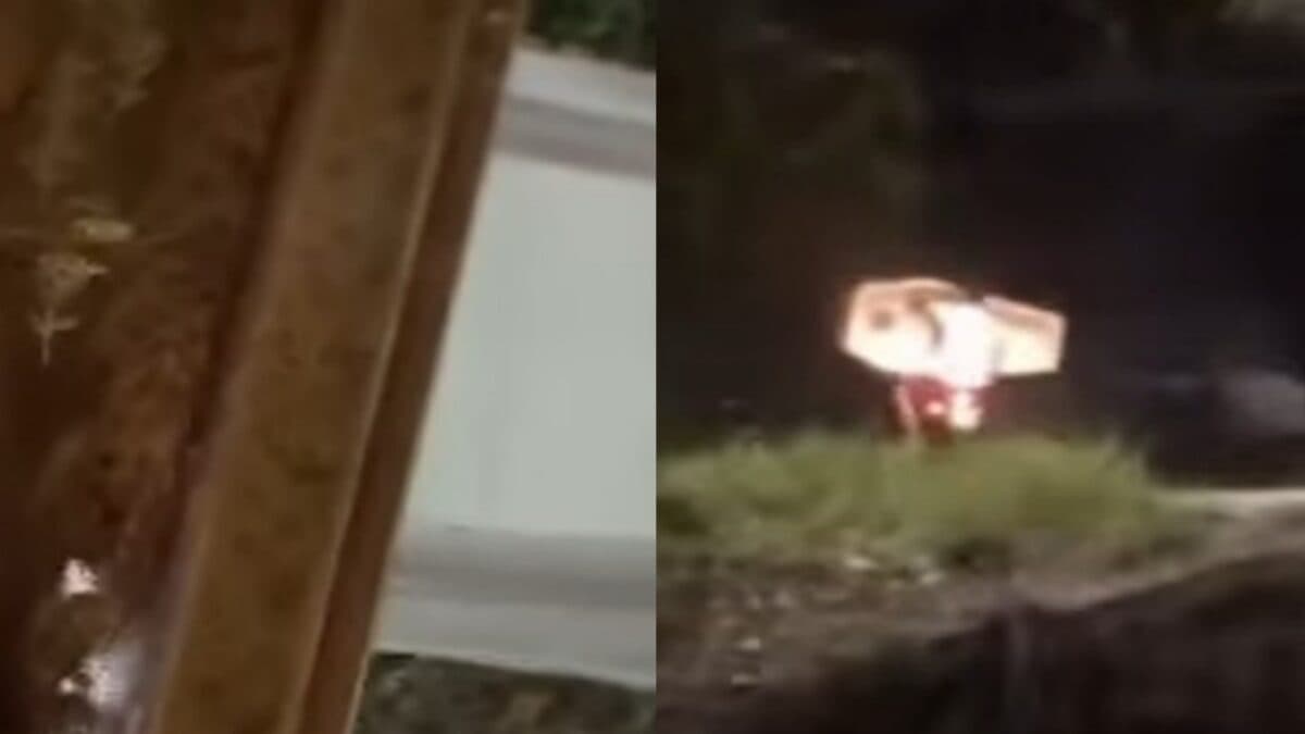 Caixões são abandonados em estrada em Rio Tinto e homens levam material em moto