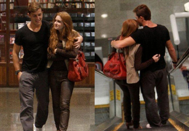 Marina Ruy Barbosa e Klebber Toledo passeiam abraçados
